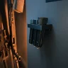 Pistol magazines in a magnetic holder mounted inside a gun safe.