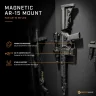 AR-15 rifle stored vertically on a magnetic mount inside a gun safe.