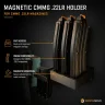 CMMG .22LR -lippaita magneettisessa telineessä asekaapin sisällä.